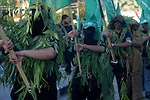 Palestinian Hamas militants march during a rally to mark 23 anniversary for Hamas movement foundation in Khan Younis refugee camp, southern Gaza Strip on 06 December 2010. Hamas is a Palestinian Islamist militant organisation which controls the Gaza strip was formed in 1987, at the outset of the first 'intifada', or Palestinian uprising against the Israeli occupation in Gaza Strip and the West Bank. Photo by Abed Rahim Khatib