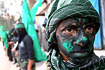 Masked Hamas members attend a rally in the Nusseirat refugee camp in the central of Gaza Strip on Dec 5, 2010 in the preparation to celebrate in the anniversary of Hamas movement foundation. Photo by Ashraf Amra