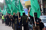 Masked Hamas members attend a rally in the Maghazi refugee camp in the central of Gaza Strip on Dec. 7 2010 in the preparation to celebrate in the anniversary of Hamas movement foundation.. Photo by Ashraf Amra