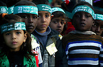 Palestinian children participate during a meeting to celebrate in the anniversary of Islamic movement foundation in the southern Gaza Strip town of Rafah on December 09, 2010. Which indicate The anniversary of the launch Hamas on December 14. Photo by Abed Rahim Khatib