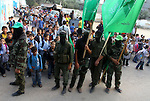 Masked Hamas members attend a rally in the Nusseirat refugee camp in the central of Gaza Strip on Dec 5, 2010 in the preparation to celebrate in the anniversary of Hamas movement foundation. Photo by Ashraf Amra