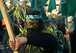 Palestinian Hamas militants march during a rally to mark 23 anniversary for Hamas movement foundation in Khan Younis refugee camp, southern Gaza Strip on 06 December 2010. Hamas is a Palestinian Islamist militant organisation which controls the Gaza strip was formed in 1987, at the outset of the first 'intifada', or Palestinian uprising against the Israeli occupation in Gaza Strip and the West Bank. Photo by Abed Rahim Khatib