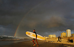 Palestinian youths practise their sport ( riding the waves ) during sunset in Gaza city beach on Dec. 6,2010. Photo by Ashraf Amra
